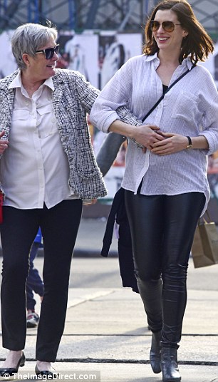 Joy: Mom and daughter looked at each other and grinned as they appeared to feel the baby move