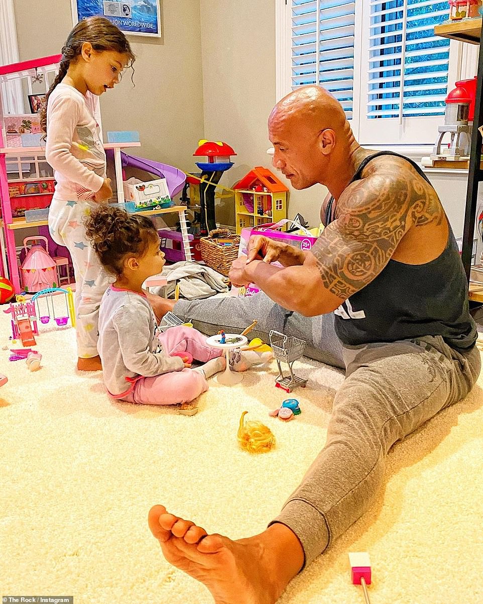 Dwayne 'The Rock' Johnson often gushes about his special bond with his daughters in a new Instagram post. Pictured, with Tia