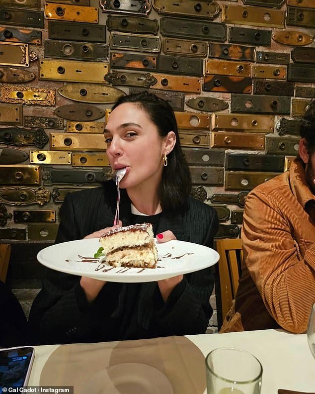 Cheeky: The actress also shared a cheeky snap as she was captured holding a birthday cake slice on a plate as she kept a spoon in her mouth