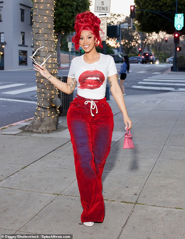 Red hot! Cardi B showed off a fiery new hair transformation while out in Beverly Hills on Monday