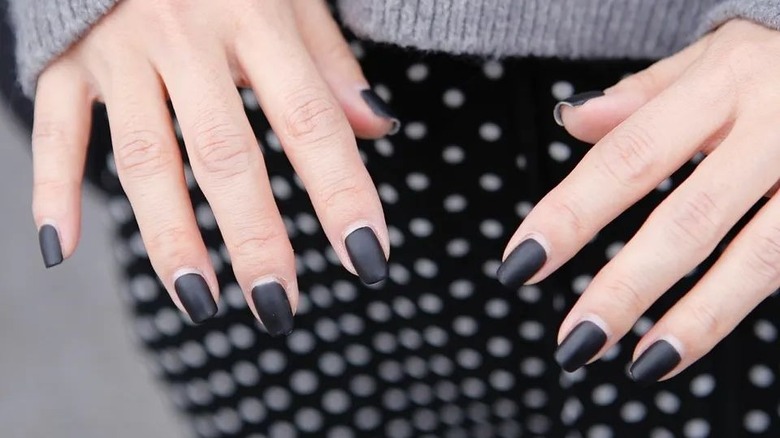 Nails with a matte black polish